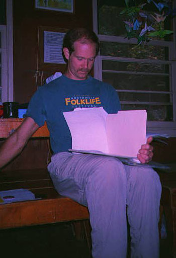 Rich checking paperwork -- by Bill
